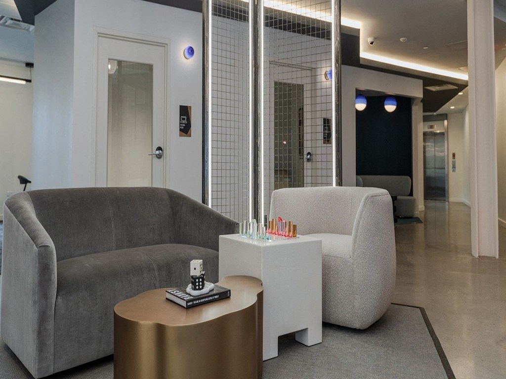 a living room with a couch and two tables